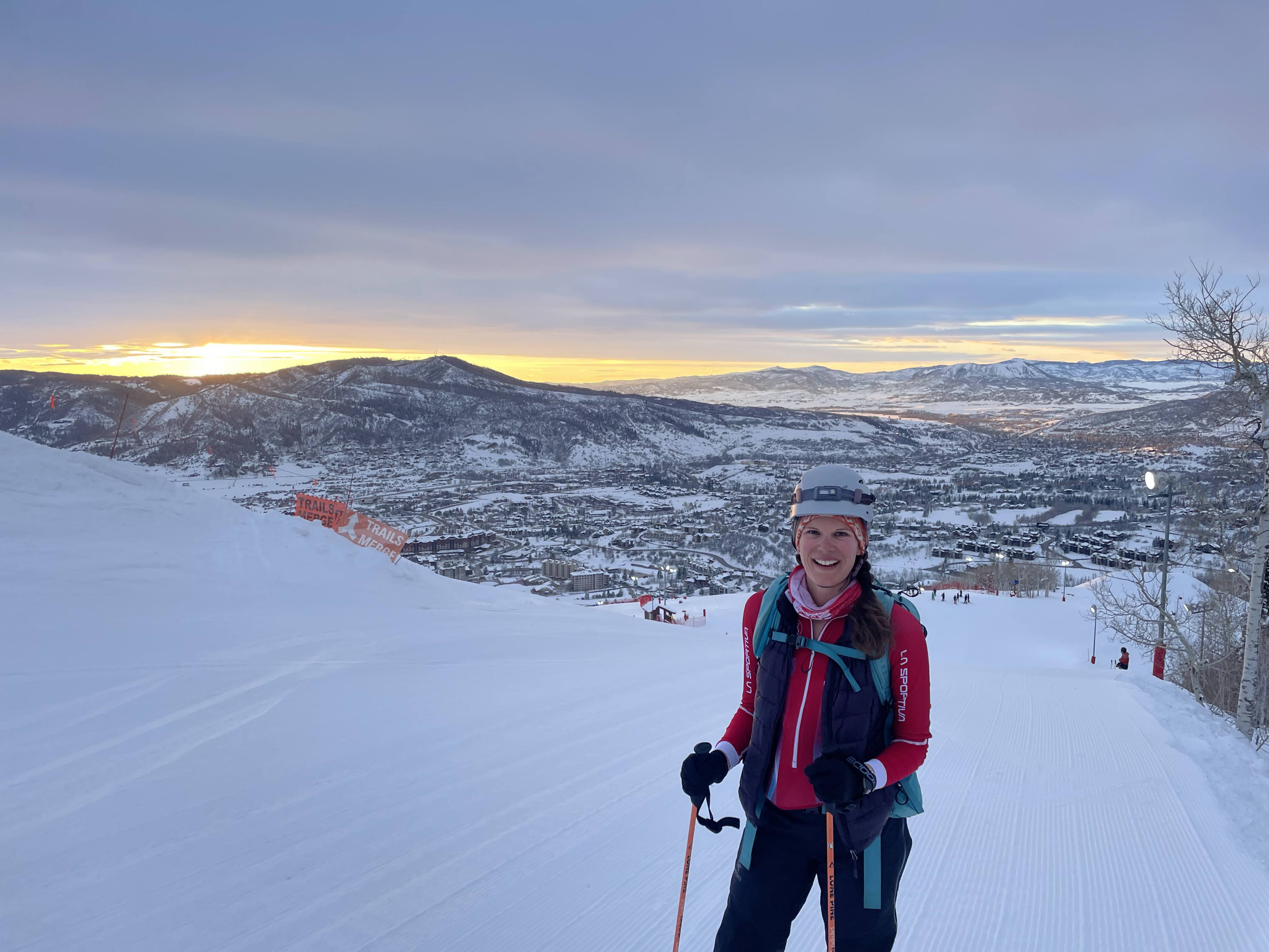Kathryn skiing uphill at
sunset.